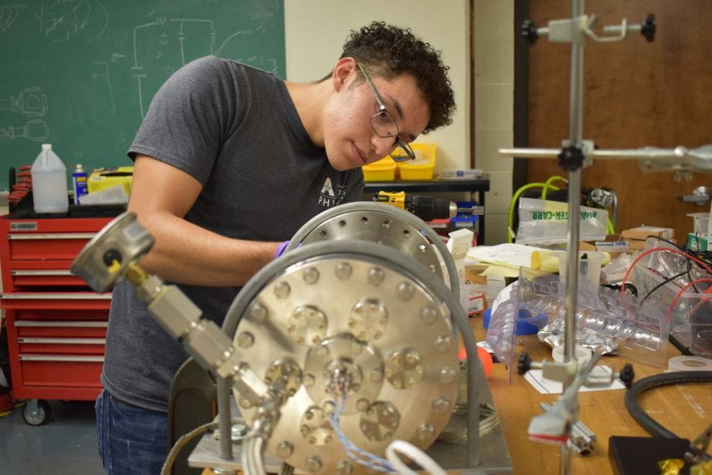 Javier Samaniego working on a neutrino detector prototype